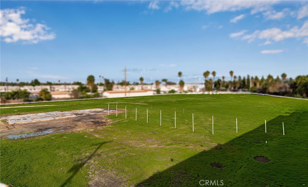7509 Arlington Riverside, CA 92503 - Photo 13 of 27 a view of a golf course with a lake