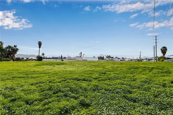 a view of an ocean with a building in the background