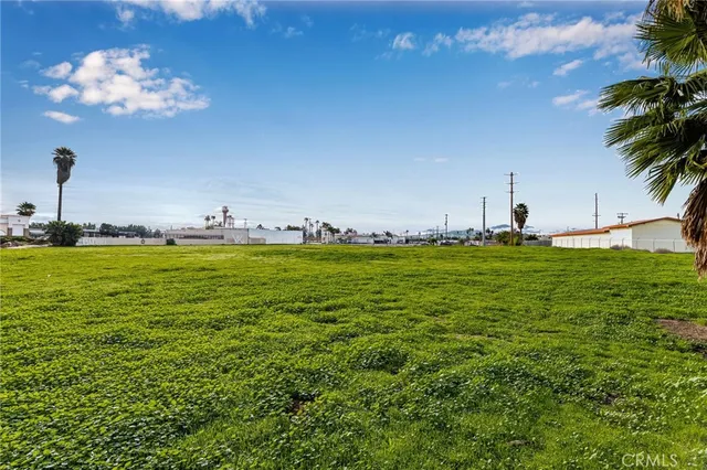 a view of pool with outdoor seating and yard