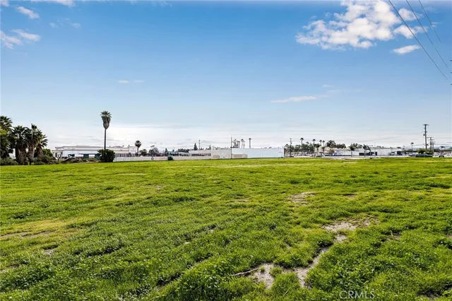 a view of an ocean with a building in the background