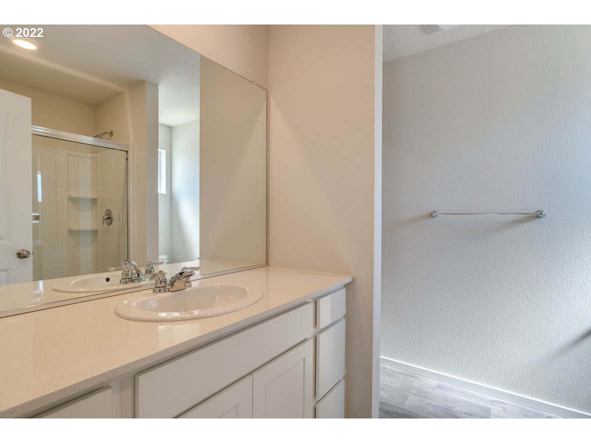 2810 North 3rd Way Ridgefield, WA 98642 - Photo 13 of 20 a bathroom with a sink and a mirror