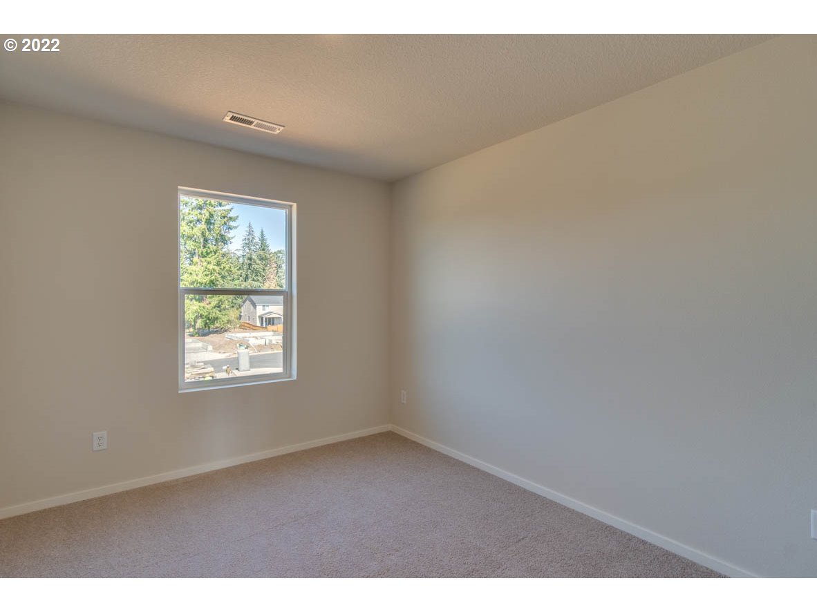 2810 North 3rd Way Ridgefield, WA 98642 - Photo 6 of 20 a view of an empty room and window