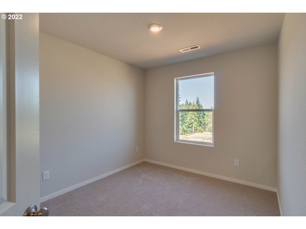 2810 North 3rd Way Ridgefield, WA 98642 - Photo 8 of 20 a view of an empty room with a window