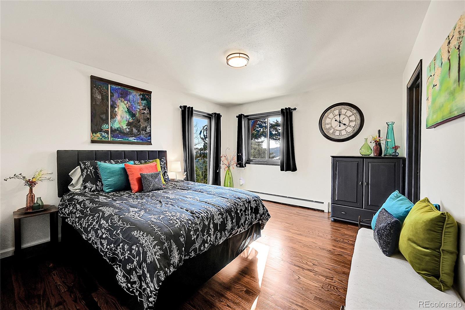 8959 South Hillview Road Morrison, CO 80465 - Photo 13 of 49 a bedroom with a bed and a window