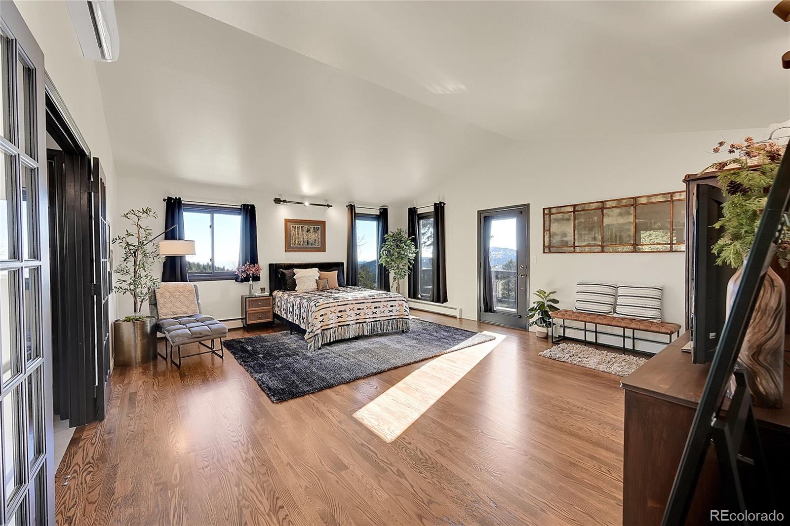 8959 South Hillview Road Morrison, CO 80465 - Photo 19 of 49 a living room with furniture and a flat screen tv