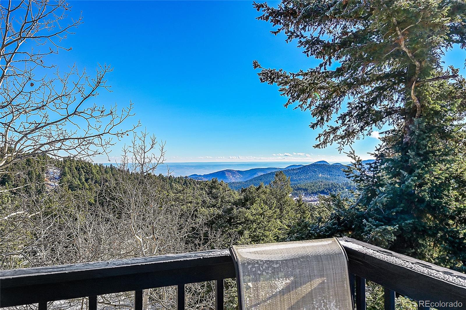 8959 South Hillview Road Morrison, CO 80465 - Photo 25 of 49 a view of a forest from a balcony