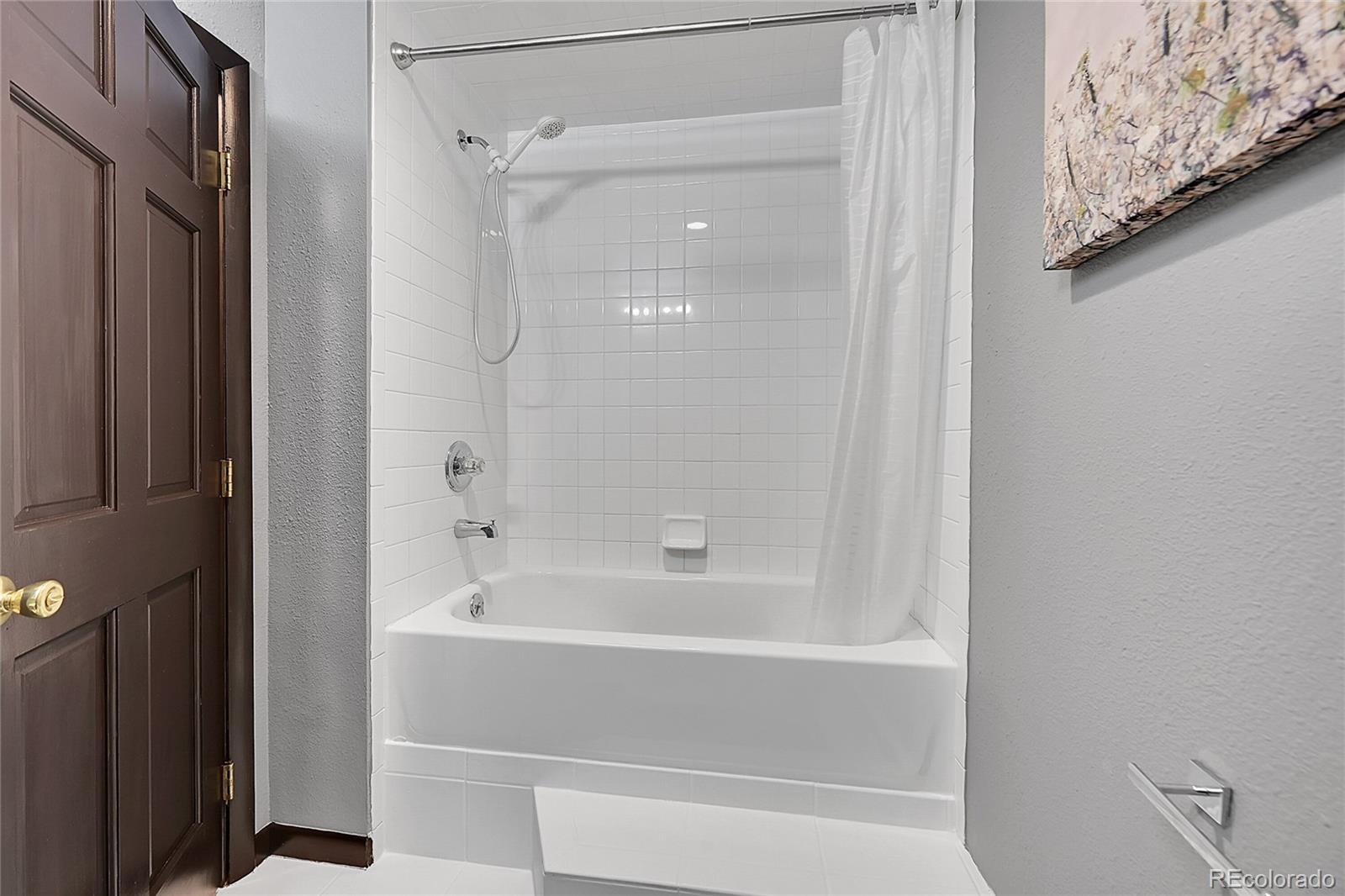8959 South Hillview Road Morrison, CO 80465 - Photo 30 of 49 a bathroom with a bathtub