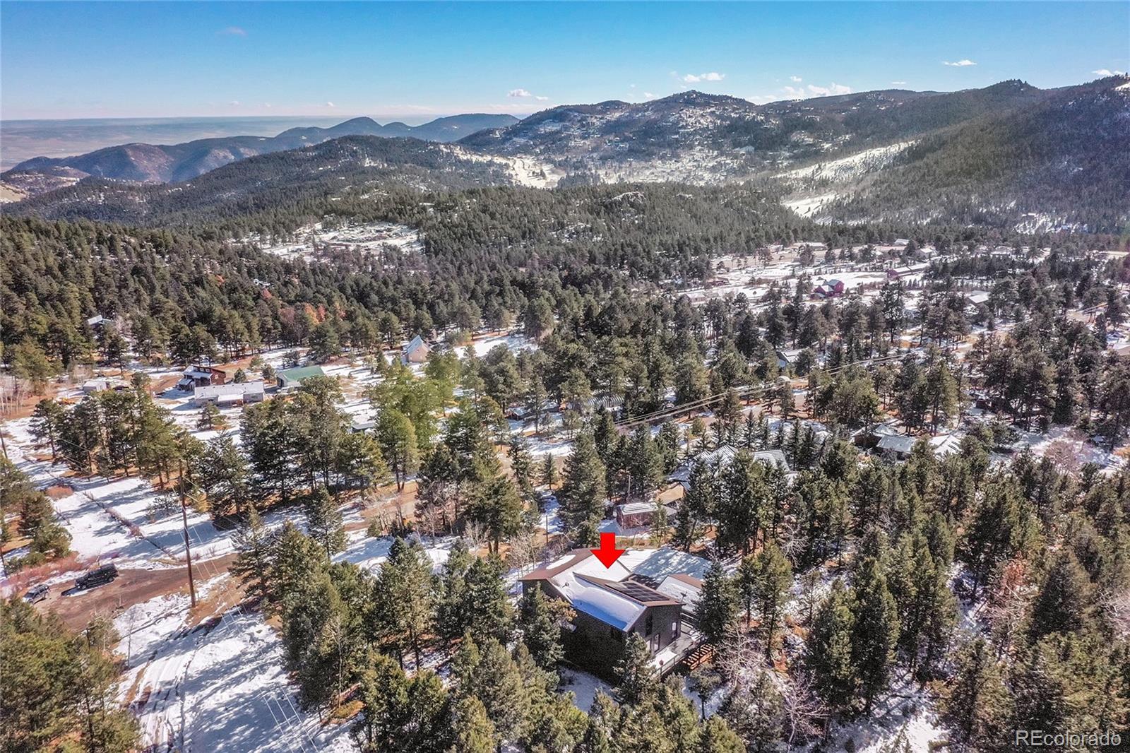 8959 South Hillview Road Morrison, CO 80465 - Photo 45 of 49 an aerial view of a houses with a lush green hillside