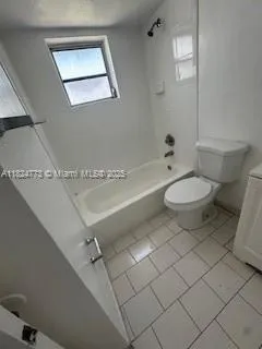 a bathroom with a toilet a sink and bathtub