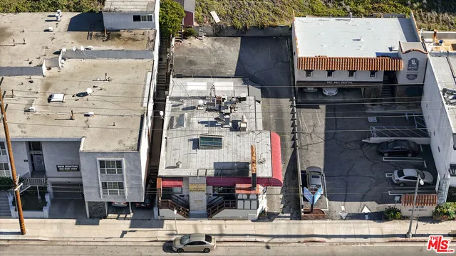 a view of a house with a street