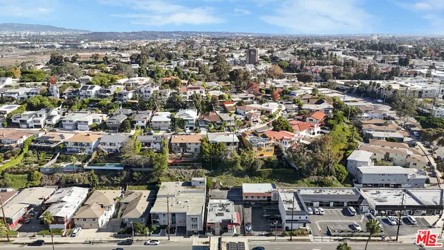 an aerial view of residential building and parking space