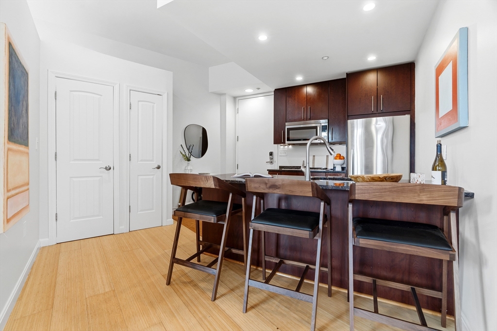 40 Fay Street, Unit 406 Boston, MA 02118 - Photo 8 of 19 a kitchen with a table and chairs in it