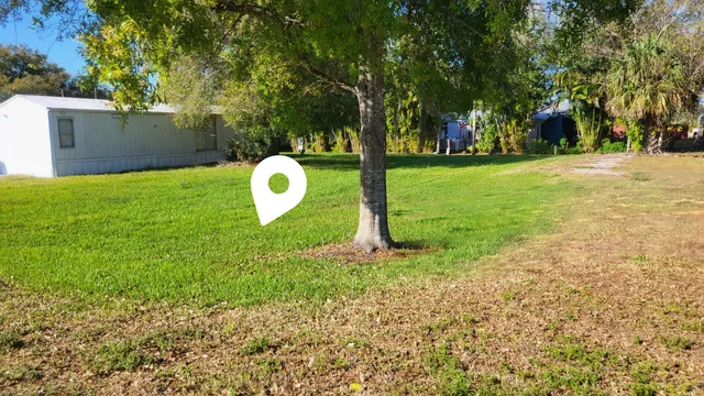 a backyard of a house with lots of green space