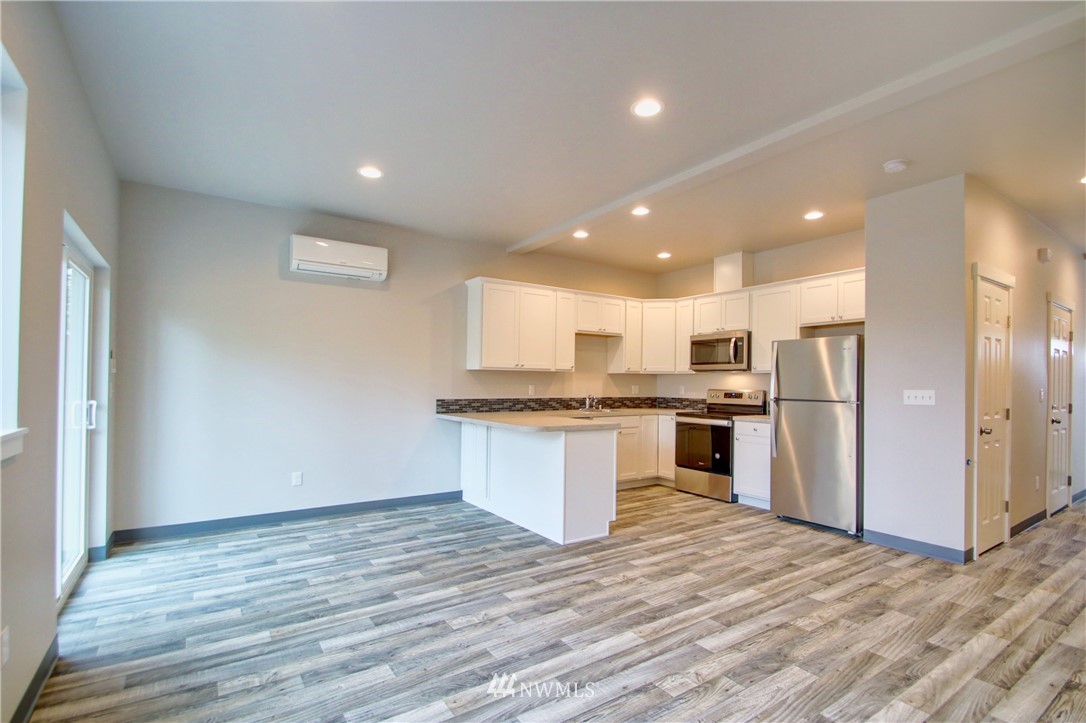 705 Peterson Road Burlington, WA 98233 - Photo 15 of 30 a large kitchen with stainless steel appliances granite countertop a stove and a refrigerator