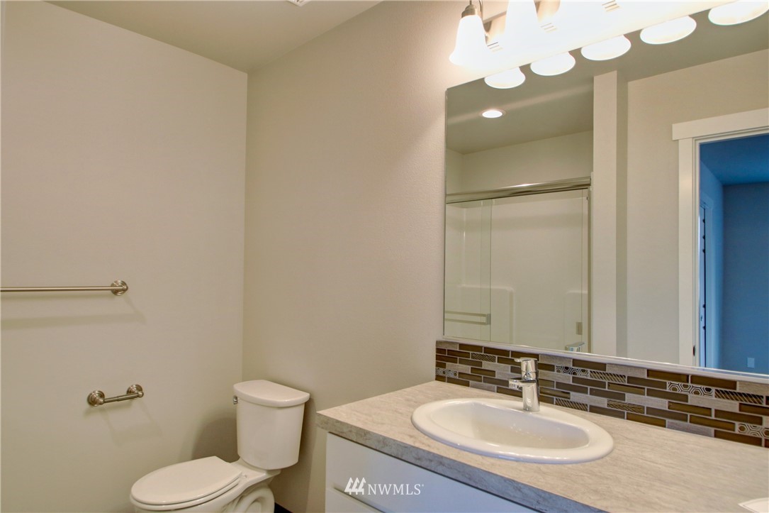 705 Peterson Road Burlington, WA 98233 - Photo 23 of 30 a bathroom with a sink and a mirror