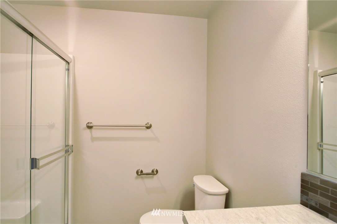 705 Peterson Road Burlington, WA 98233 - Photo 24 of 30 a white toilet sitting next to a shower