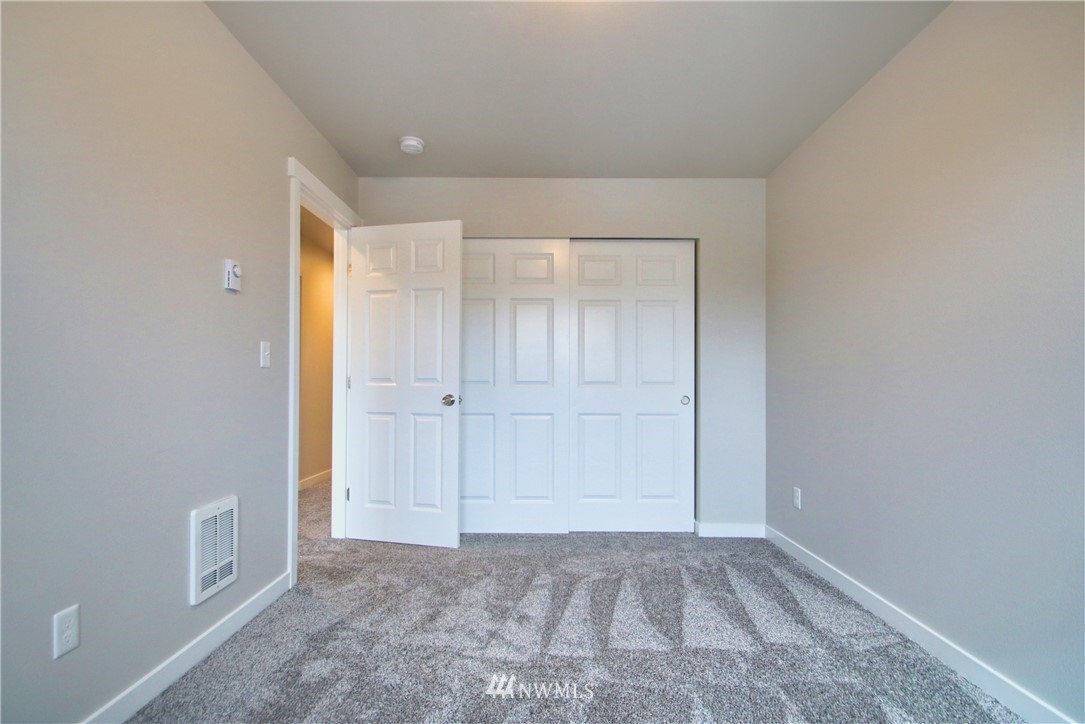 705 Peterson Road Burlington, WA 98233 - Photo 28 of 30 wooden floor in an empty room