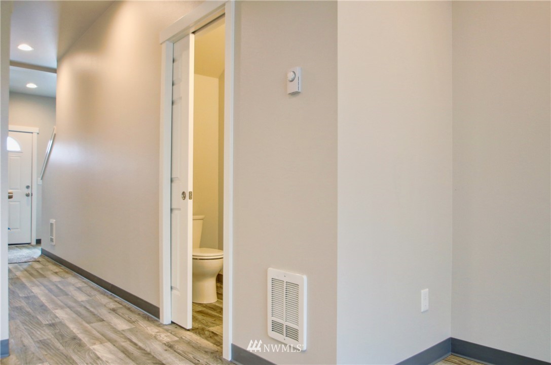 705 Peterson Road Burlington, WA 98233 - Photo 5 of 30 a view of a hallway with wooden floor