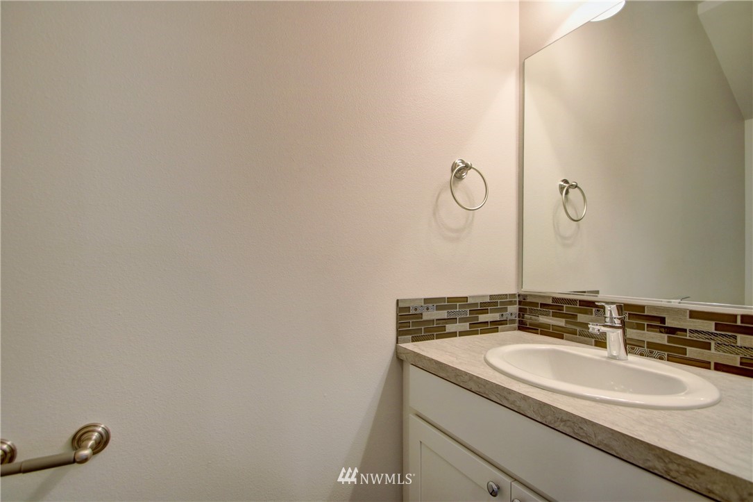 705 Peterson Road Burlington, WA 98233 - Photo 6 of 30 a bathroom with a granite countertop sink and mirror