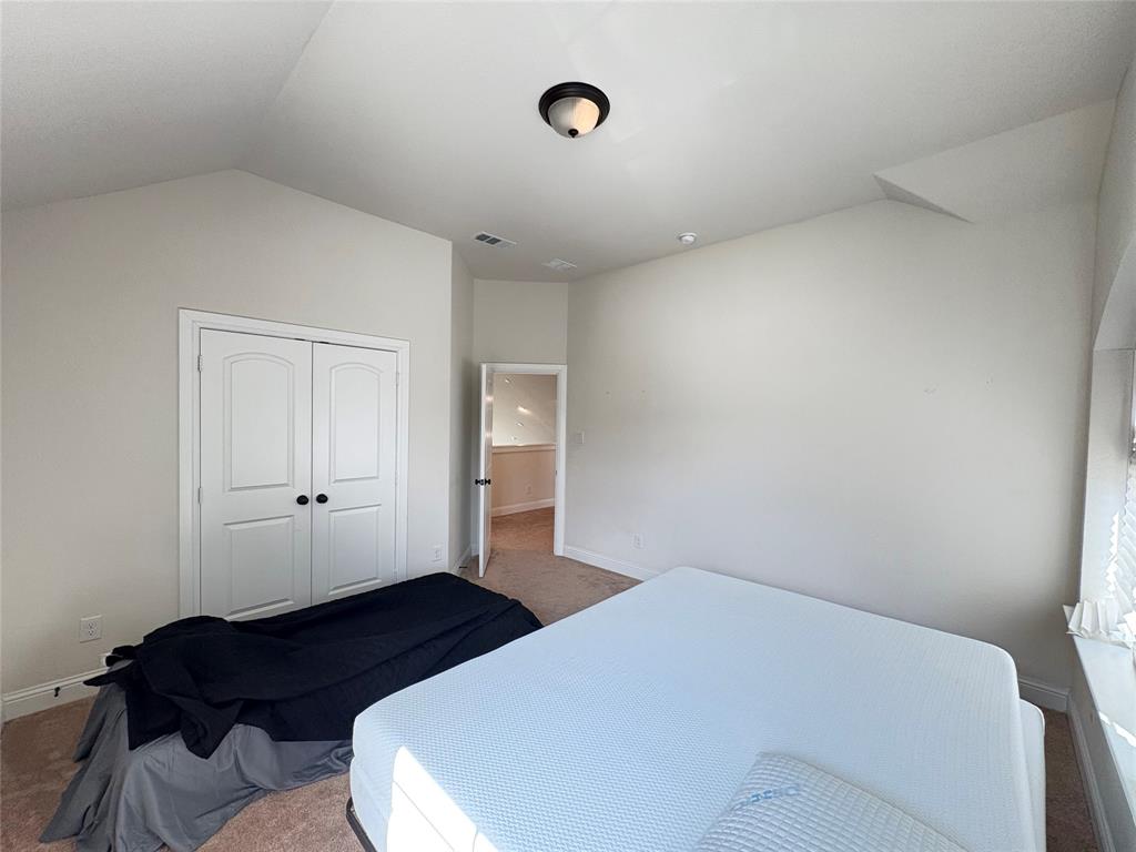 323 Butternut Way Irving, TX 75063 - Photo 24 of 32 a bedroom with bed and a cabinet