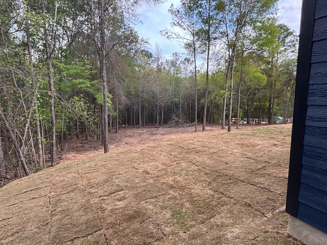 732 Moye Road Columbus, GA 31907 - Photo 10 of 10 a backyard of a house with lots of trees