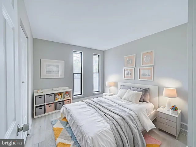 a bedroom with a bed furniture and a window