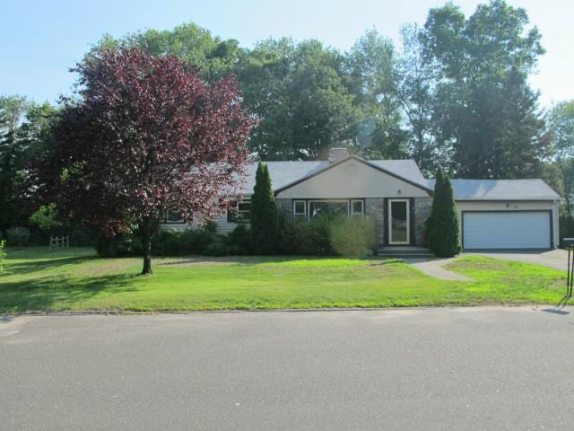 25 MacArthur Road Trumbull, CT 06611 - Photo 1 of 1 a house with trees in the background