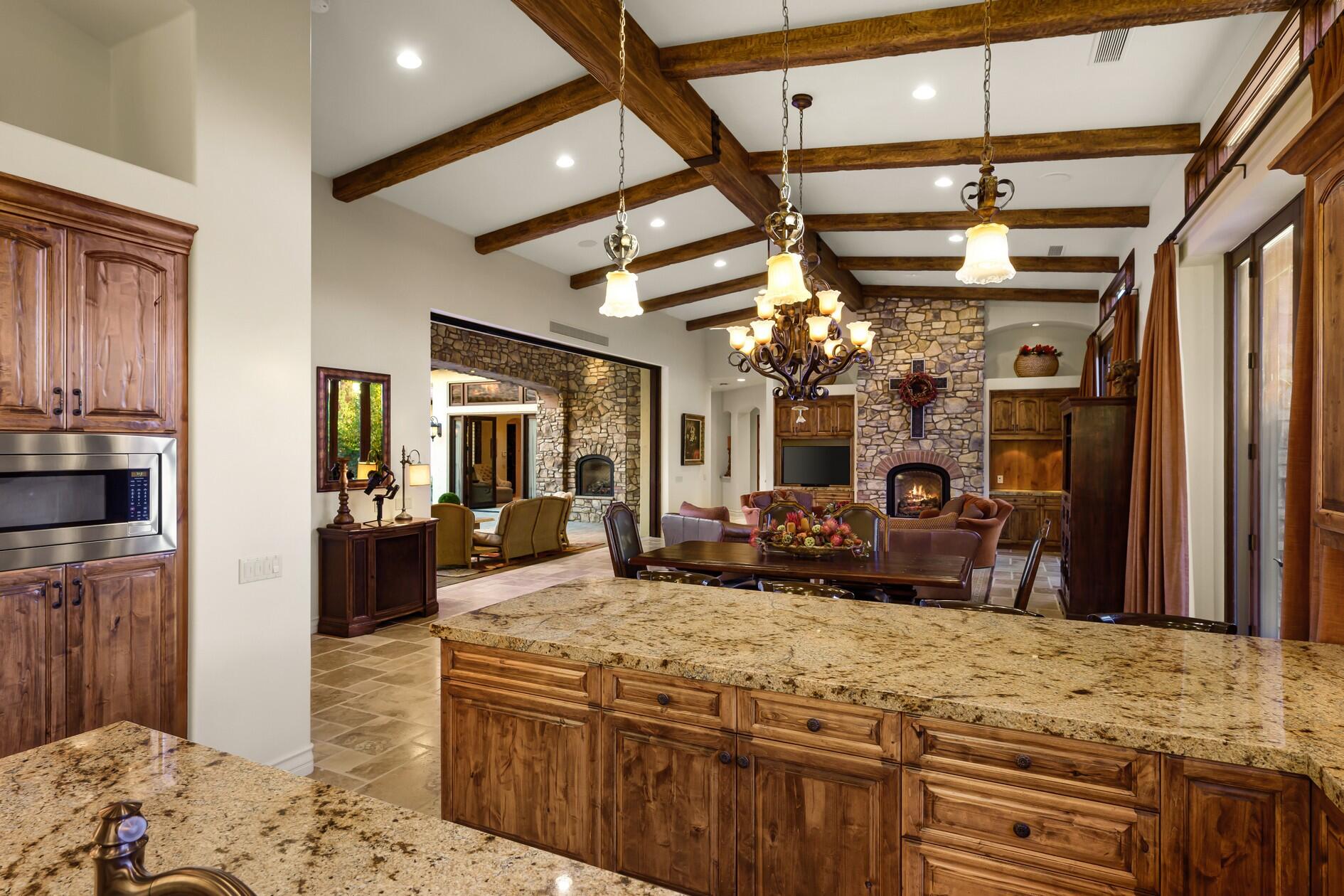 77169 Casa Del Sol La Quinta, CA 92253 - Photo 12 of 50 a view of a kitchen center island sink stove and refrigerator