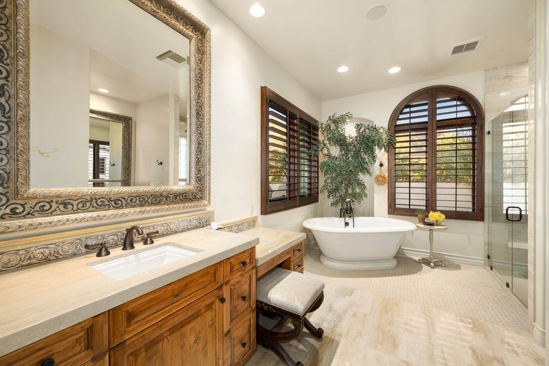 77169 Casa Del Sol La Quinta, CA 92253 - Photo 20 of 50 a spacious bathroom with a sink mirror and a bathtub