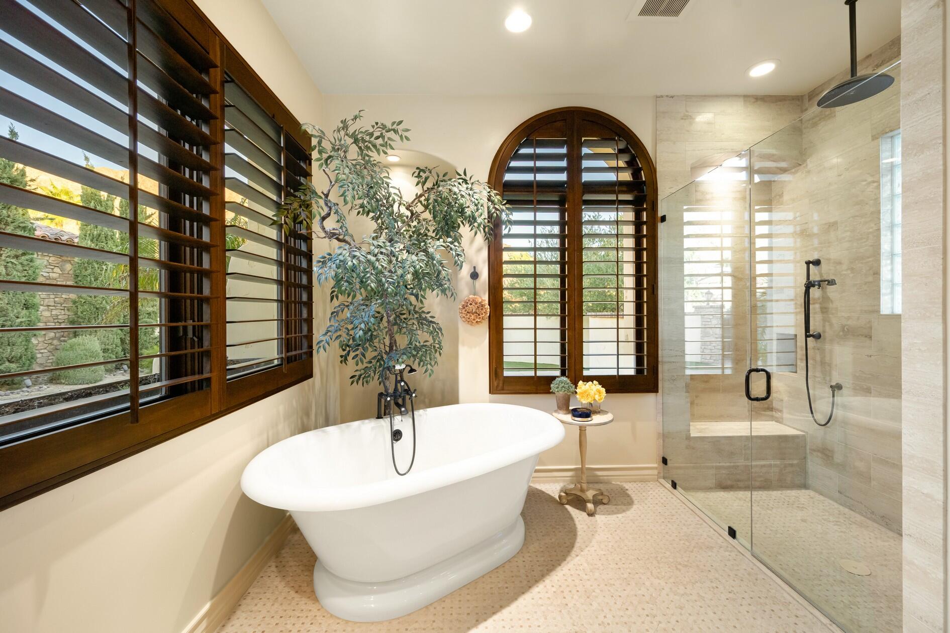 77169 Casa Del Sol La Quinta, CA 92253 - Photo 21 of 50 a bathroom with a large window and a bathtub