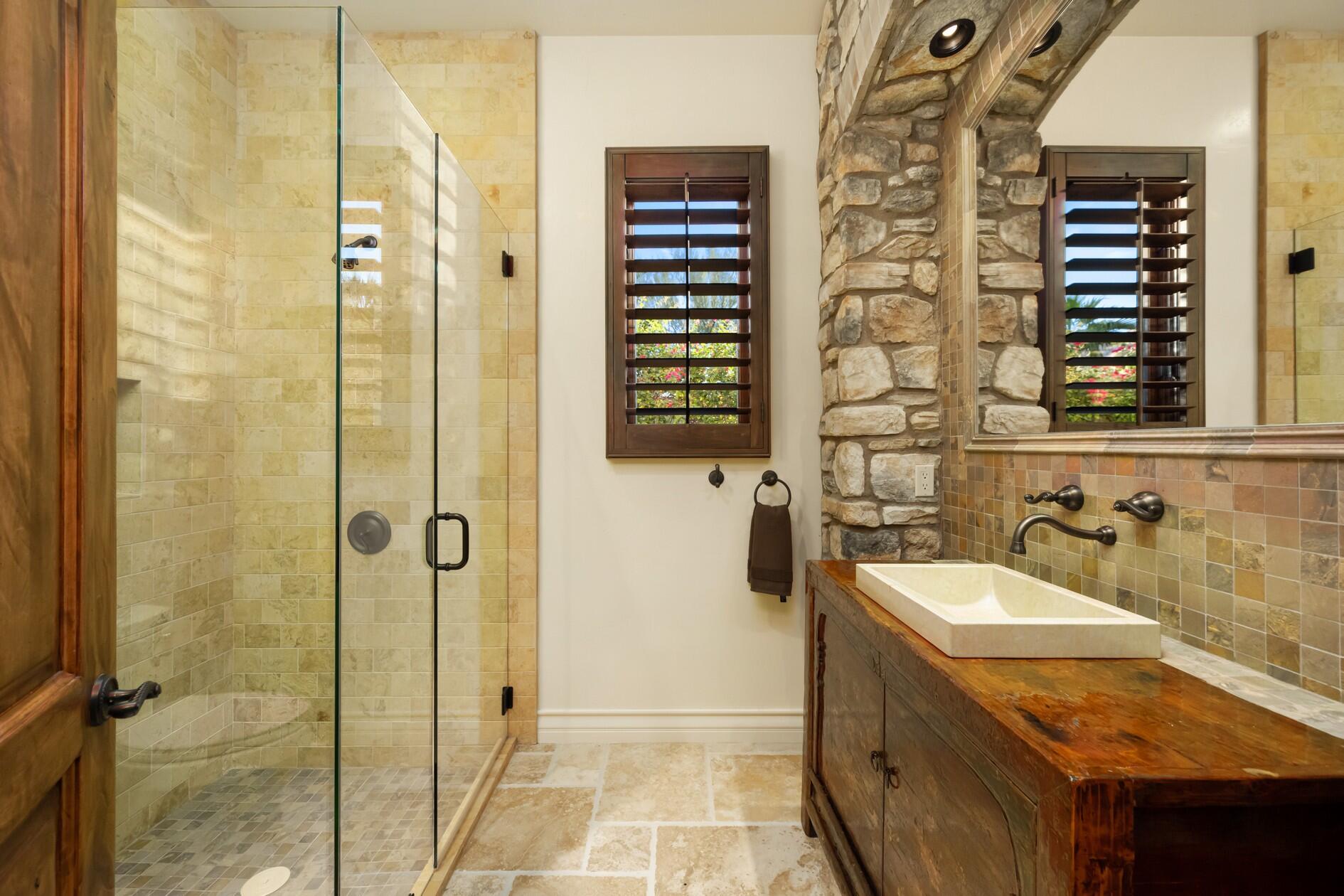 77169 Casa Del Sol La Quinta, CA 92253 - Photo 23 of 50 a bathroom with a sink and a mirror