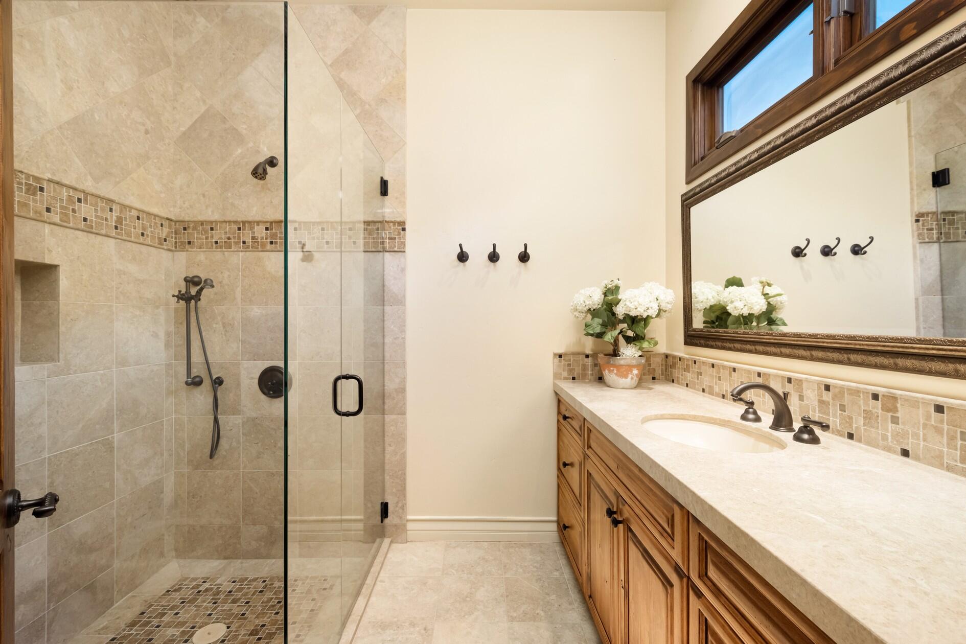 77169 Casa Del Sol La Quinta, CA 92253 - Photo 25 of 50 a bathroom with a double vanity sink mirror and shower