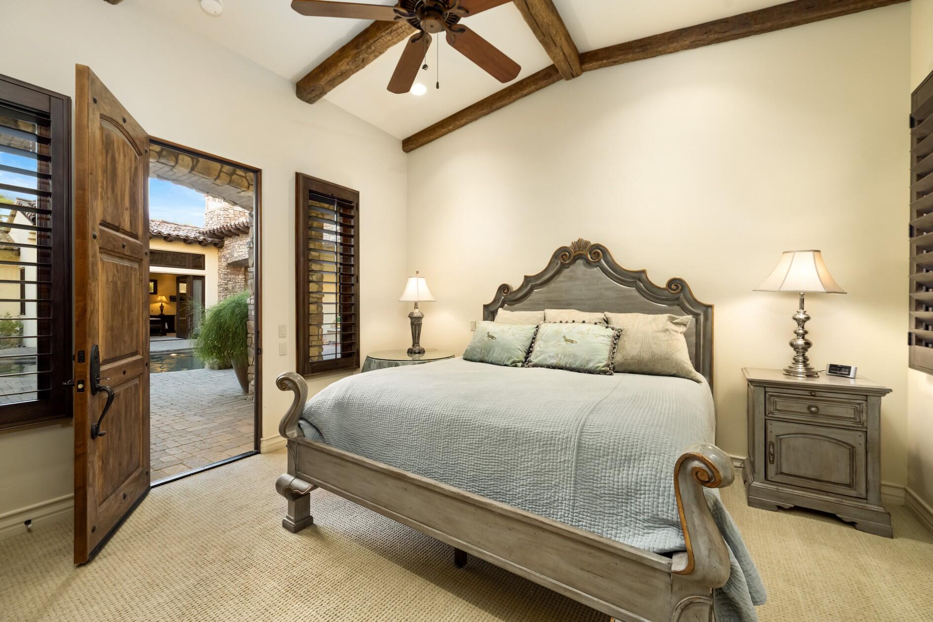 77169 Casa Del Sol La Quinta, CA 92253 - Photo 27 of 50 a bedroom with a bed and large mirror