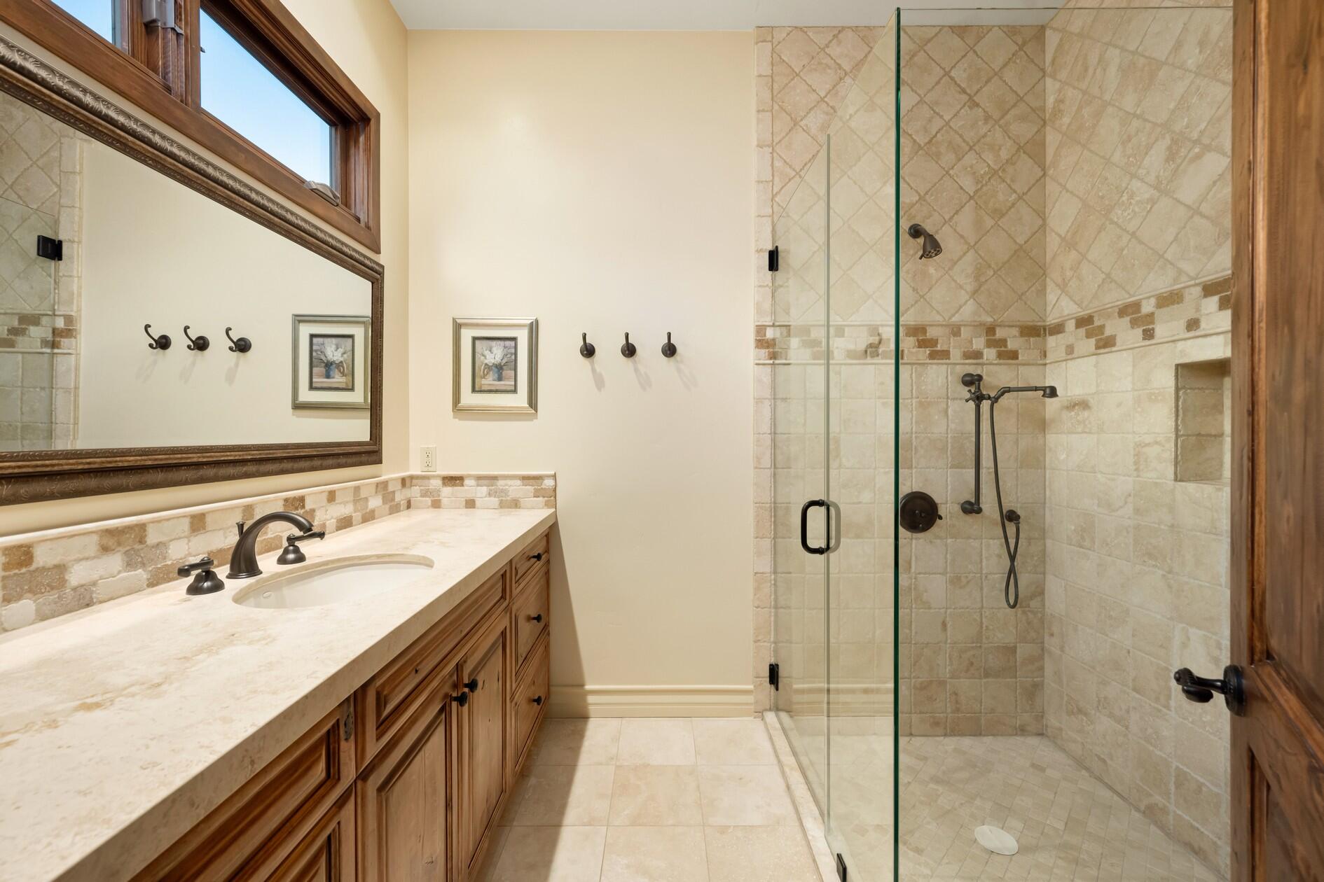 77169 Casa Del Sol La Quinta, CA 92253 - Photo 28 of 50 a bathroom with a sink a vanity and shower