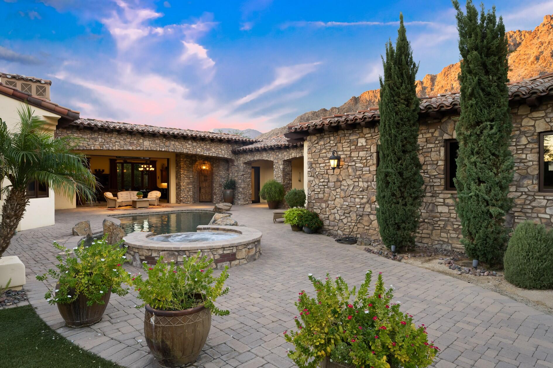 77169 Casa Del Sol La Quinta, CA 92253 - Photo 31 of 50 a front view of a house with garden