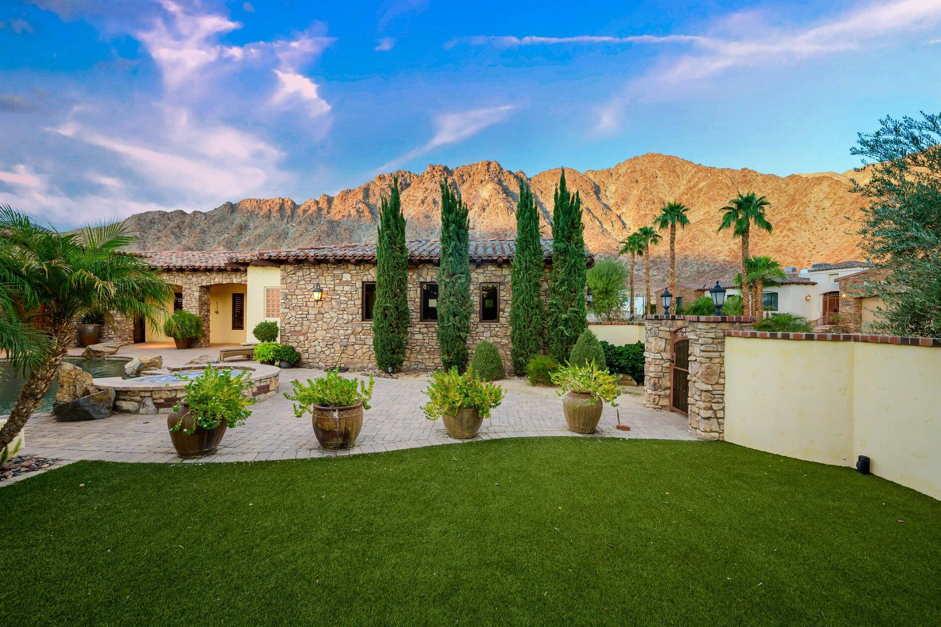 77169 Casa Del Sol La Quinta, CA 92253 - Photo 32 of 50 a view of a house with backyard and a sitting area