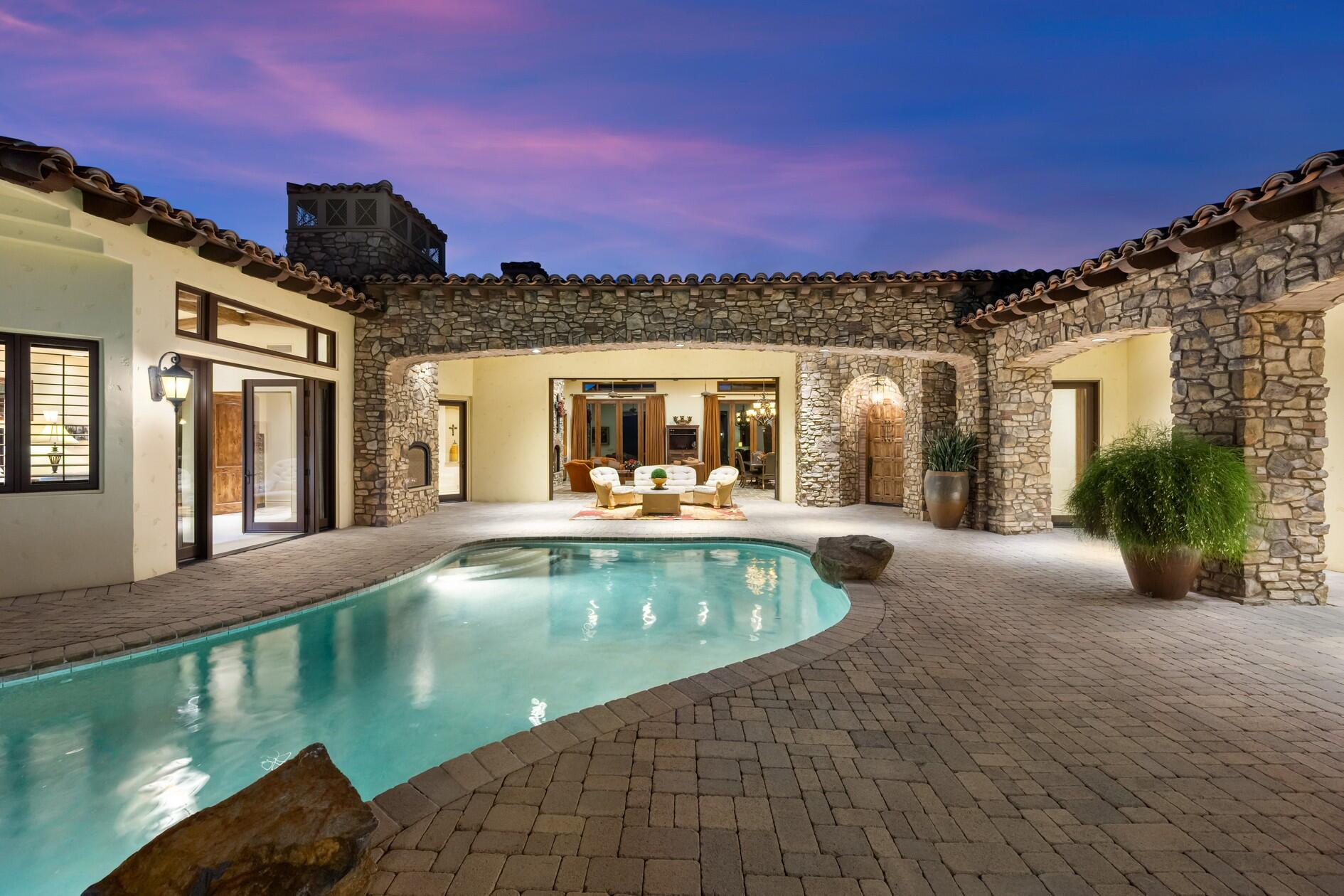 77169 Casa Del Sol La Quinta, CA 92253 - Photo 37 of 50 a view of a swimming pool with a chairs