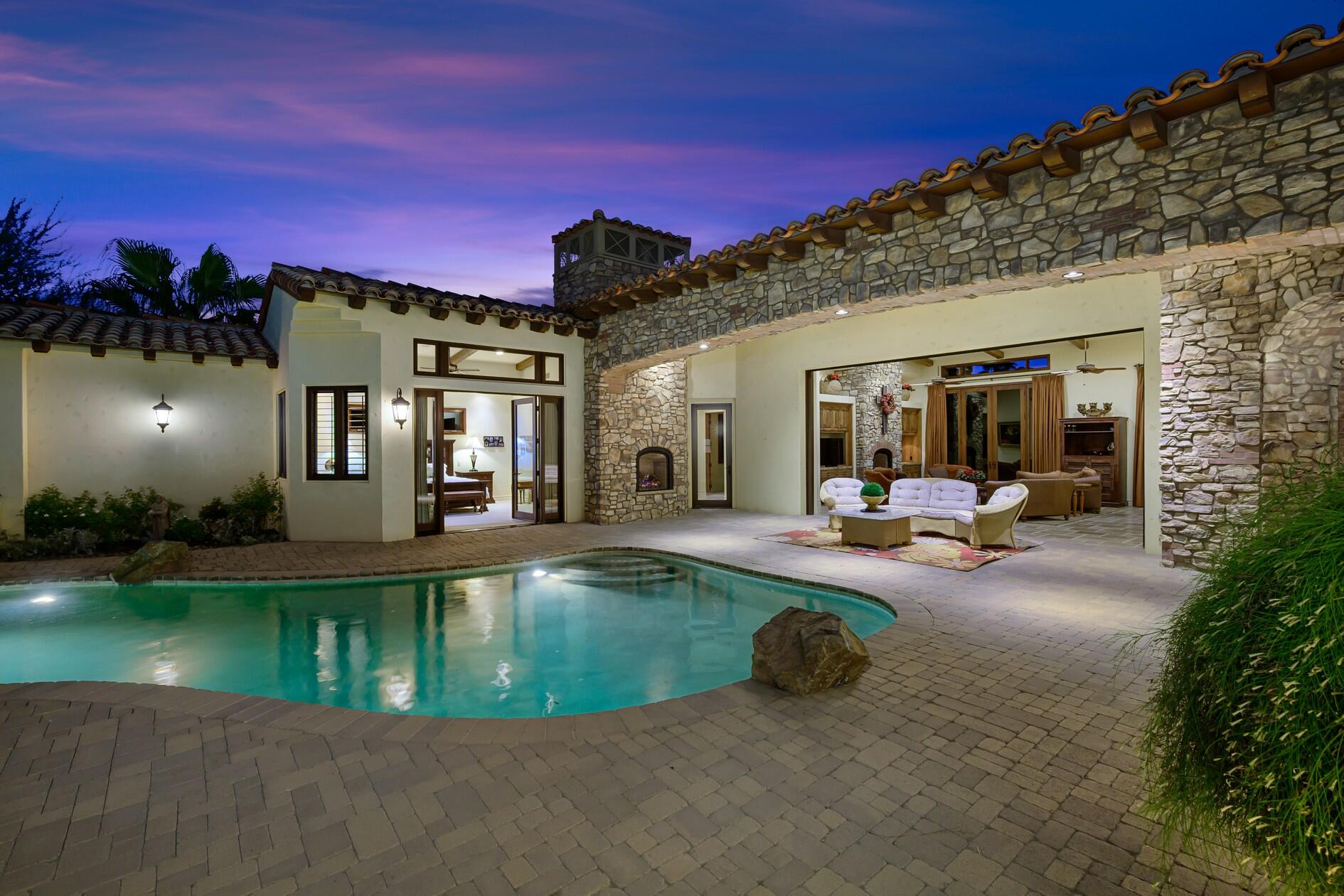 77169 Casa Del Sol La Quinta, CA 92253 - Photo 39 of 50 a view of a house with swimming pool and sitting area
