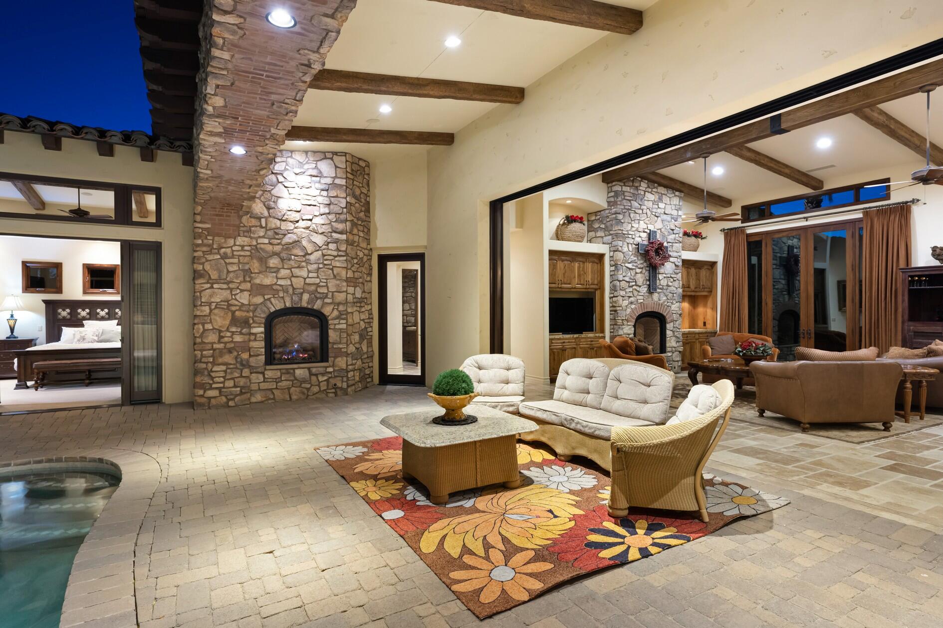 77169 Casa Del Sol La Quinta, CA 92253 - Photo 40 of 50 a living room with furniture and a fireplace