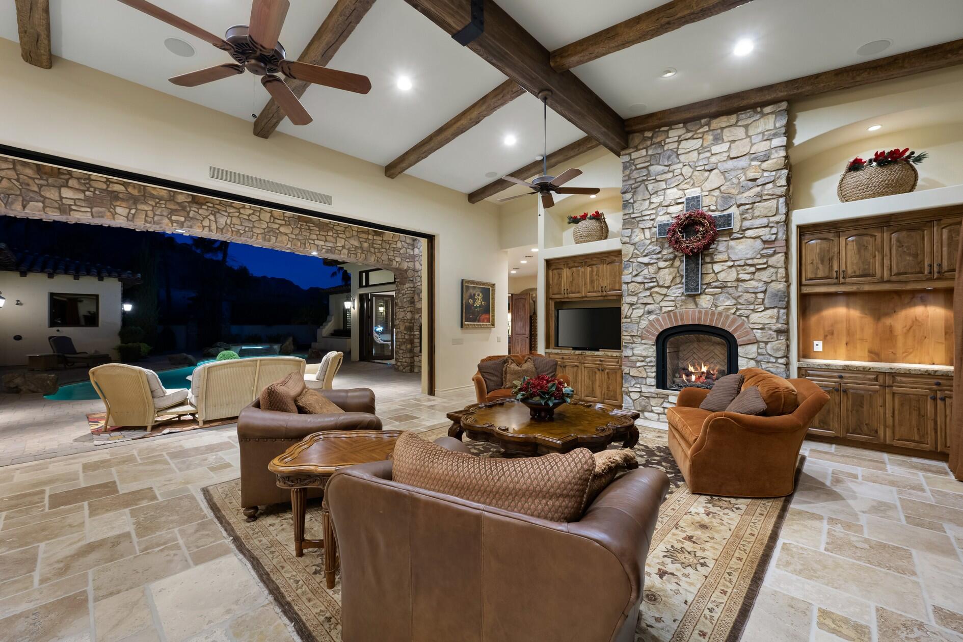 77169 Casa Del Sol La Quinta, CA 92253 - Photo 41 of 50 a living room with furniture and a fireplace