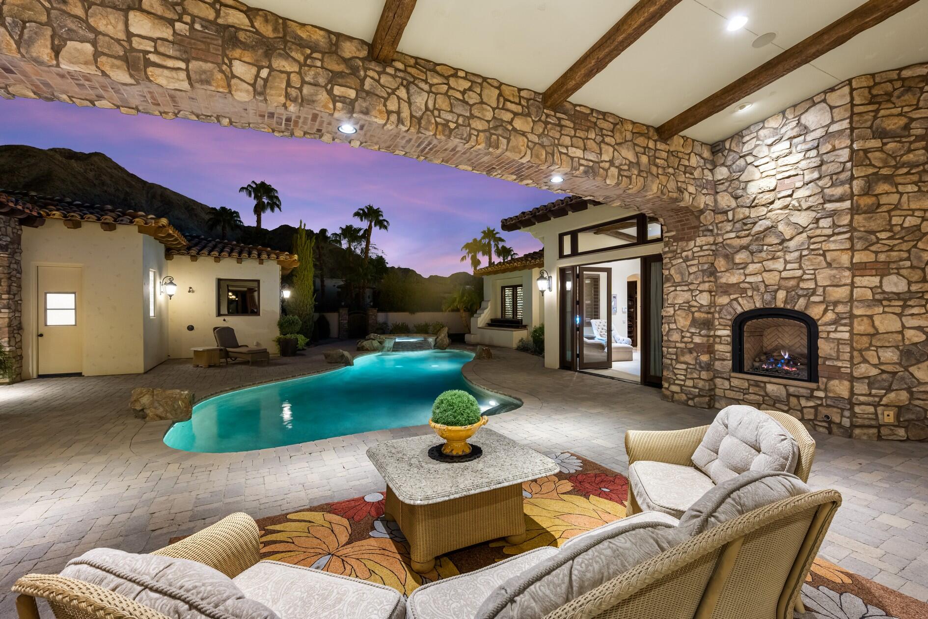 77169 Casa Del Sol La Quinta, CA 92253 - Photo 43 of 50 a living room with furniture and a fireplace