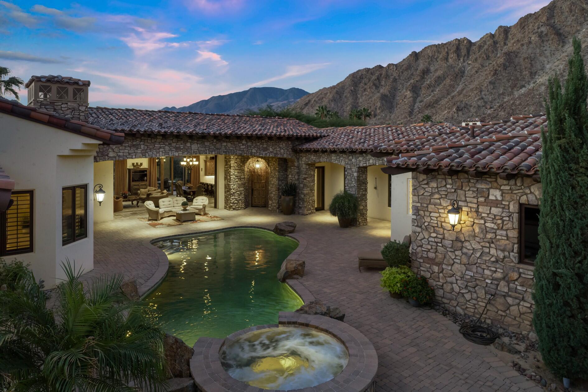 77169 Casa Del Sol La Quinta, CA 92253 - Photo 45 of 50 a swimming pool with outdoor seating and garden