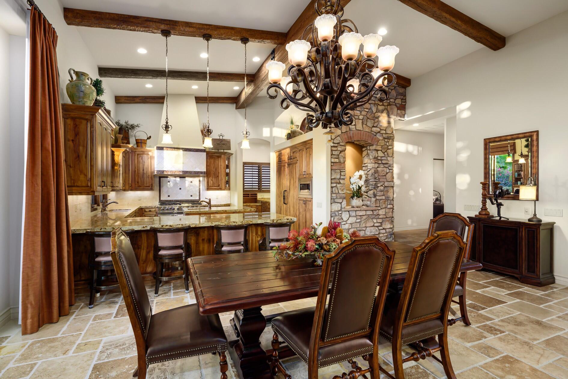 77169 Casa Del Sol La Quinta, CA 92253 - Photo 8 of 50 a view of a dining room with furniture and chandelier