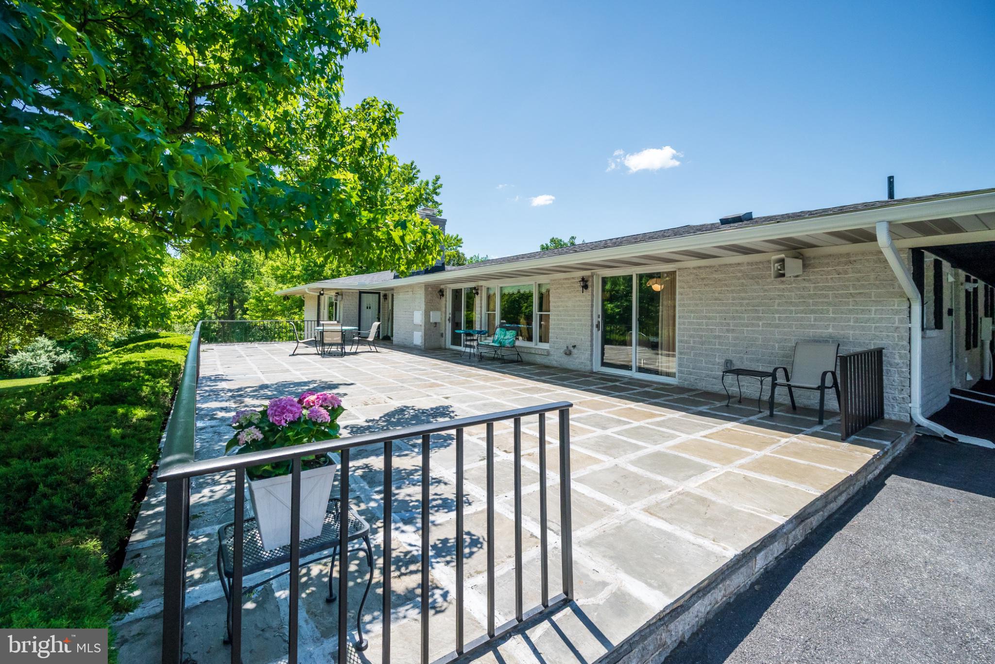 4212 Dustin Road Burtonsville, MD 20866 - Photo 56 of 65 Spacious patio with lush greenery.