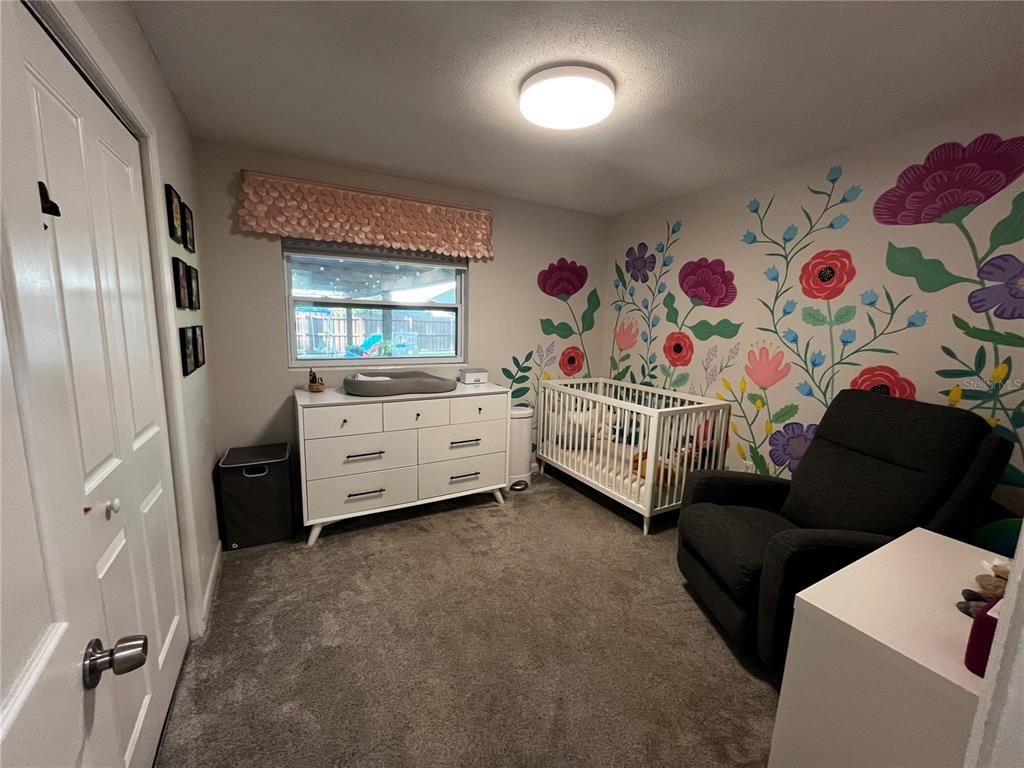 714 Denton Road Winter Park, FL 32792 - Photo 17 of 32 a bedroom with a bed and a window