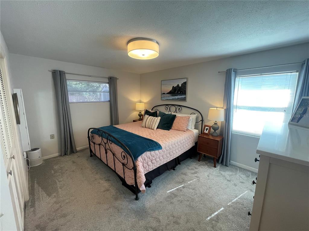 714 Denton Road Winter Park, FL 32792 - Photo 22 of 32 a bedroom with a bed and a window