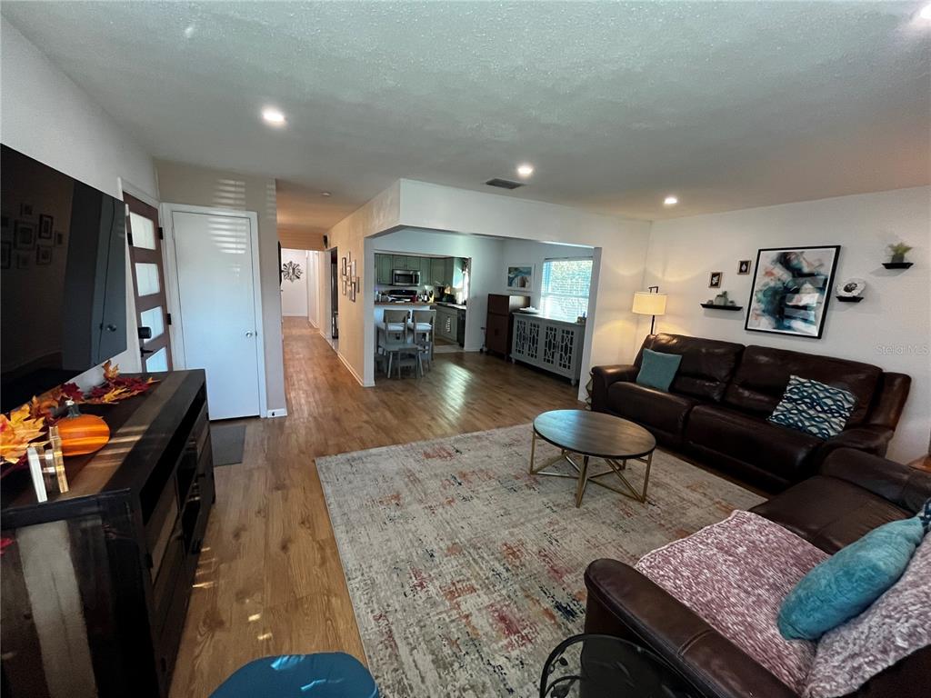 714 Denton Road Winter Park, FL 32792 - Photo 3 of 32 a living room with furniture and a flat screen tv