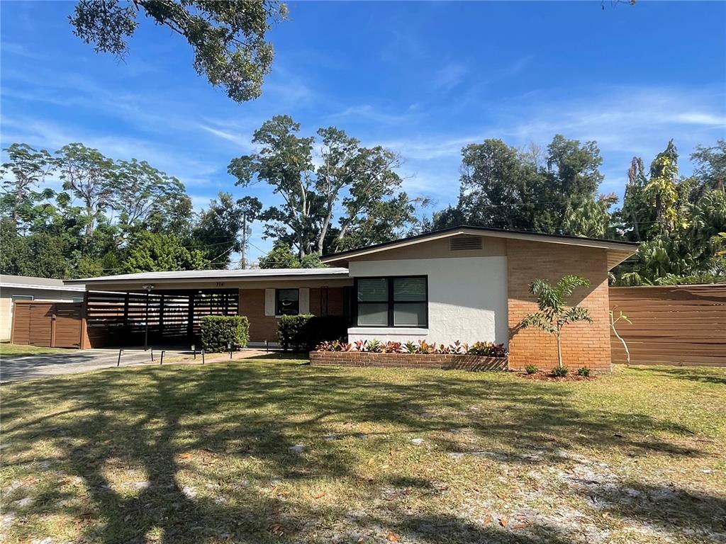 714 Denton Road Winter Park, FL 32792 - Photo 32 of 32 a view of a house with a yard