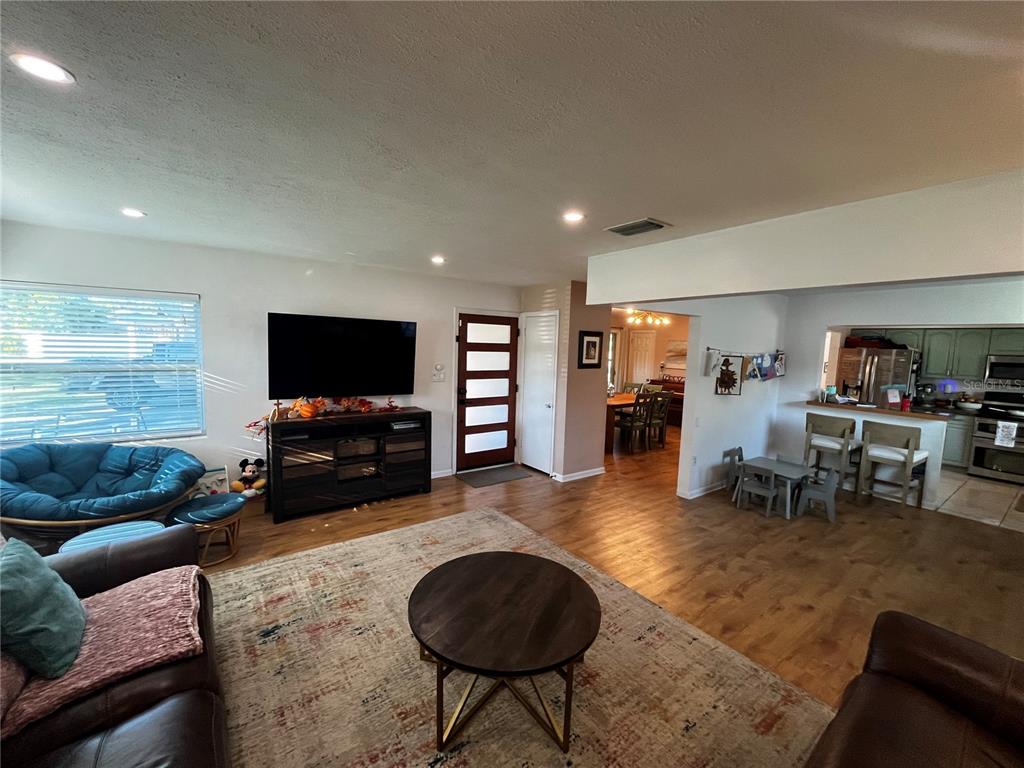 714 Denton Road Winter Park, FL 32792 - Photo 5 of 32 a living room with furniture and a flat screen tv