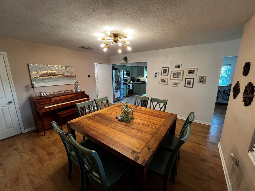 714 Denton Road Winter Park, FL 32792 - Photo 10 of 32 a view of a dining room with furniture
